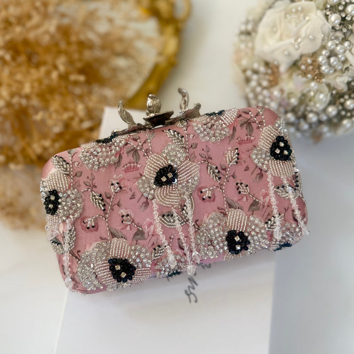 Pink clutch bag with floral with beaded details