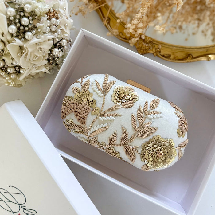 Ivory clutch bag with gold floral embroidery