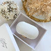 Ivory clutch bag with gold floral embroidery