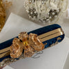 Royal blue clutch with gold floral embroidery